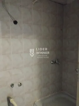 View of the bathroom with ceramic tiles and a shower cabin. - image 16