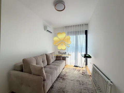 Bright living room with a sofa and access to the terrace. - image 8