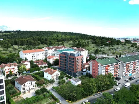 Aerial view of residential buildings and the surrounding neighborhood. - image 5