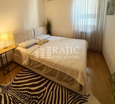 Furnished bedroom with a double bed. - image 2