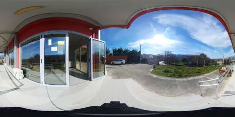 Panoramic view of the commercial space exterior with a paved courtyard and parking. - image 14