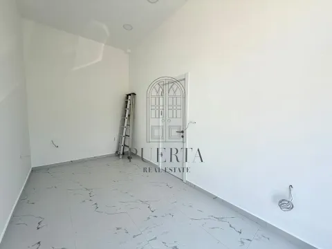 Empty room in a new building with tiled floor and a ladder. - image 5