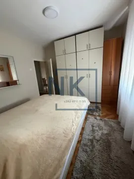 Furnished bedroom with a double bed and fitted wardrobes. - image 5