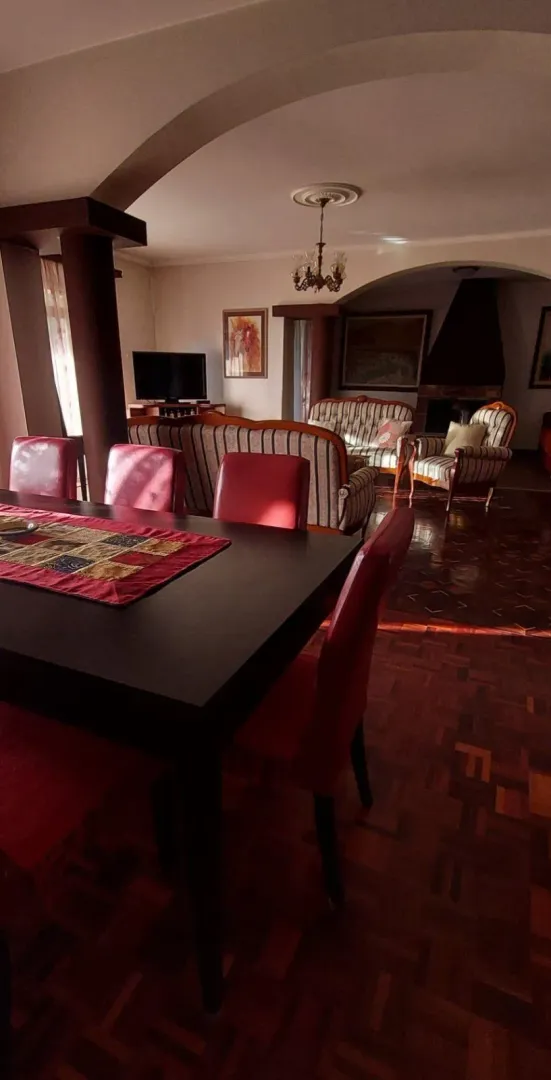 Spacious living room with a dining table and sofa set.