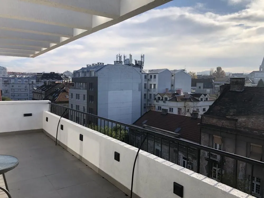 Spacious terrace with a city view.