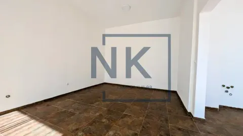 Empty unfurnished room with white walls and floor tiles. - image 5