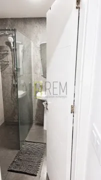 View of a modernly decorated bathroom with a walk-in shower. - image 5