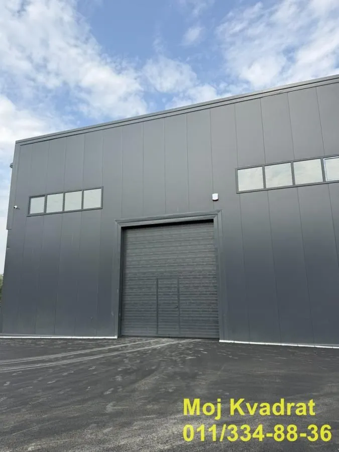 Exterior view of an industrial building with roller doors.