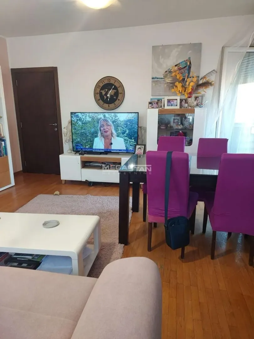 Living room with a dining area and seating set.