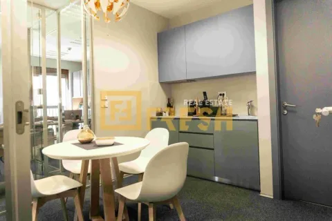 Small kitchen with a dining table and chairs. - image 4