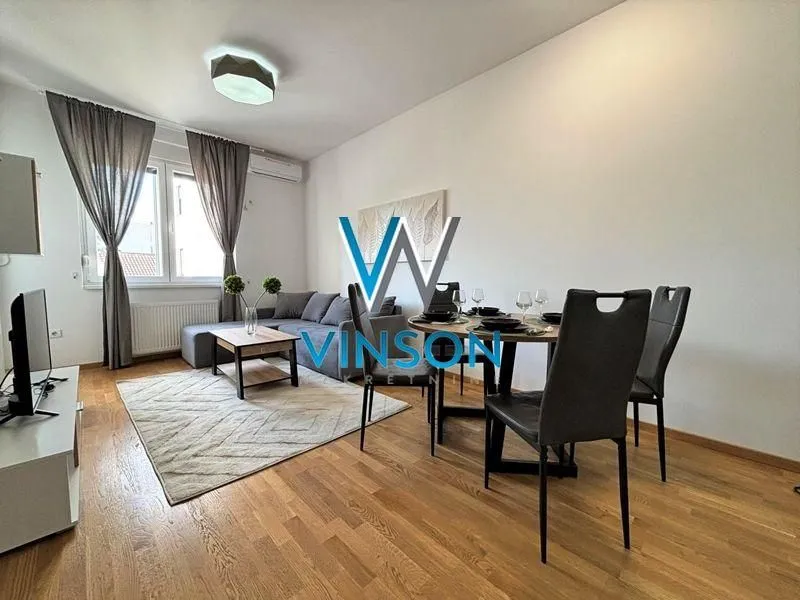 Living room with dining area and sofa.