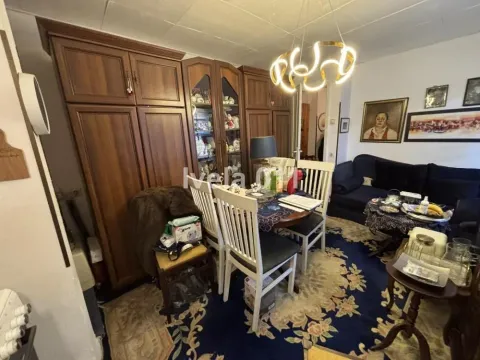 Living room with seating furniture and a dining area. - image 8
