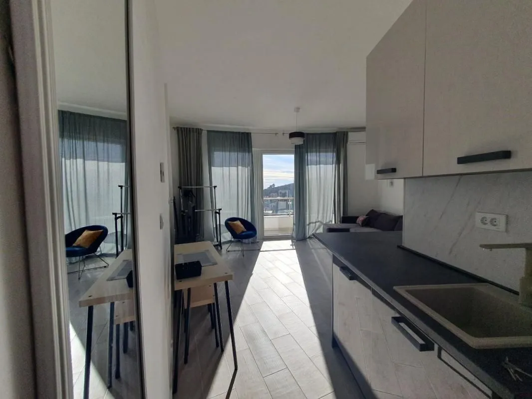 View from the kitchen towards the living room and terrace access.