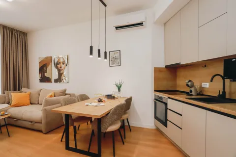Living room with dining area and kitchen. - image 6