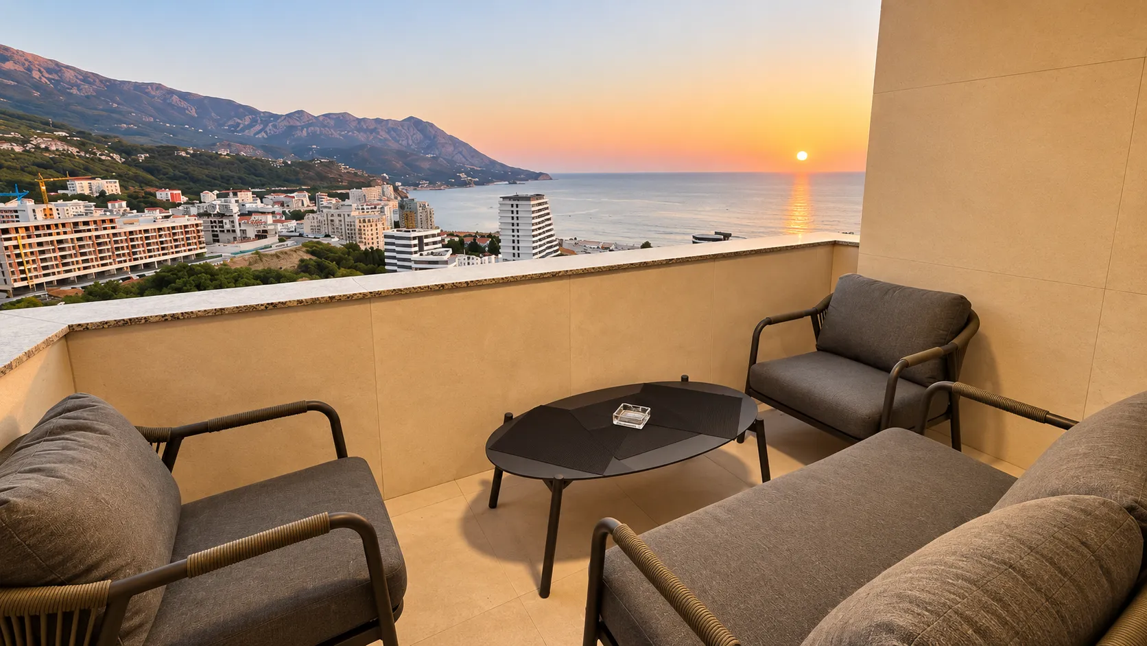 Furnished terrace with seating set and sea view.
