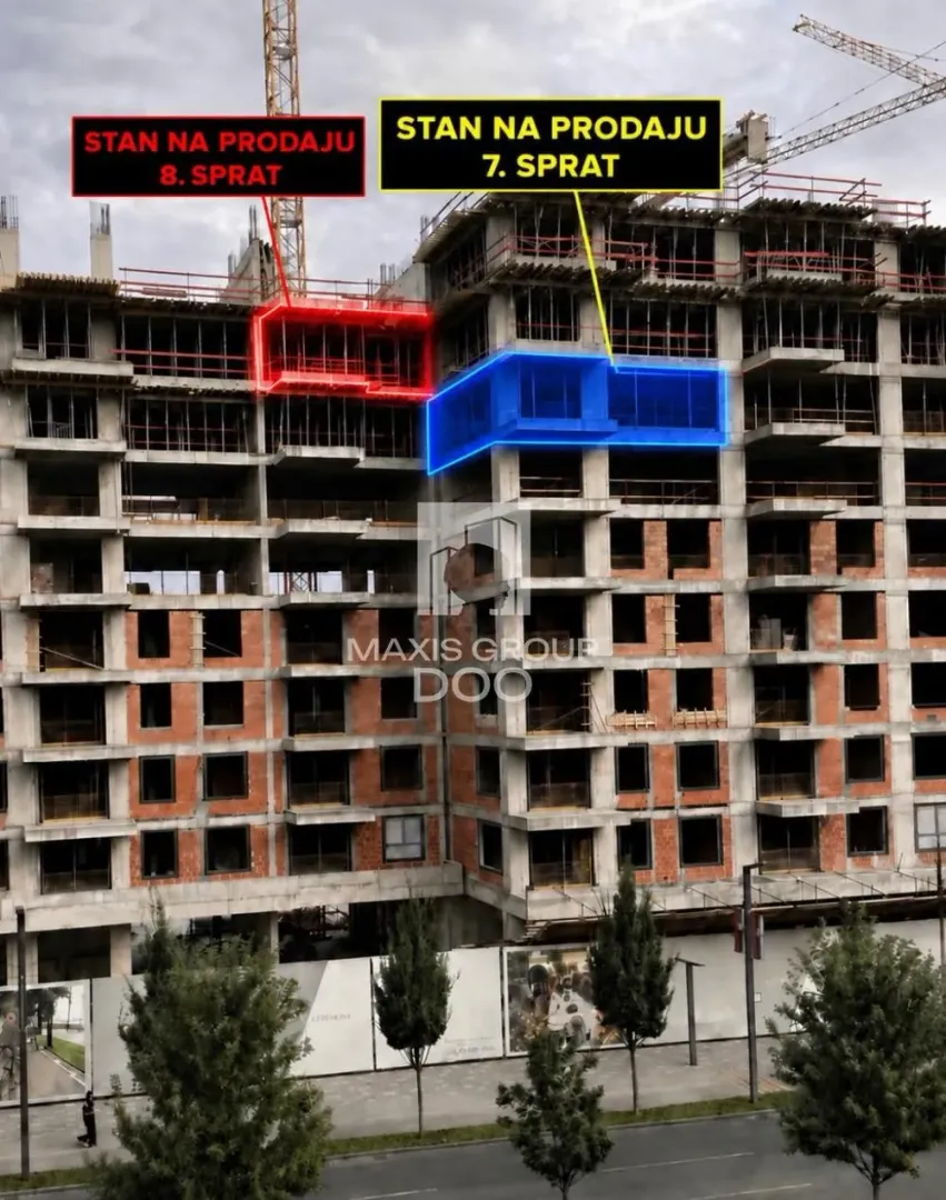 View of a residential building under construction with marked apartments for sale.