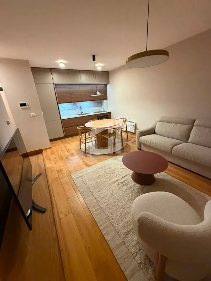 Open-plan living room with dining area and kitchen.