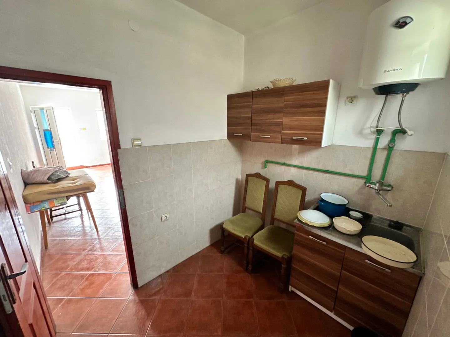 Small kitchen with basic units and a sink.