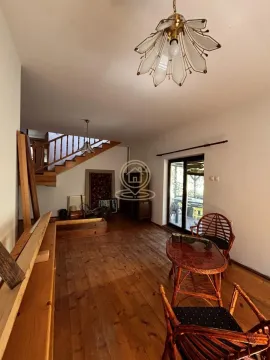 Living room with wooden floor, staircase and access to the terrace. - image 2