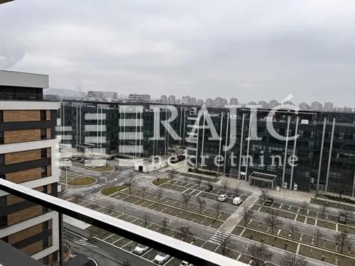View from the terrace overlooking an urban neighborhood and office buildings.