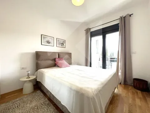 Furnished bedroom with a double bed, parquet flooring, and access to the terrace. - image 7