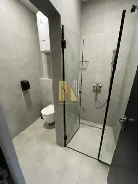 Modern bathroom with a walk-in shower and light-toned sanitary ware. - image 6