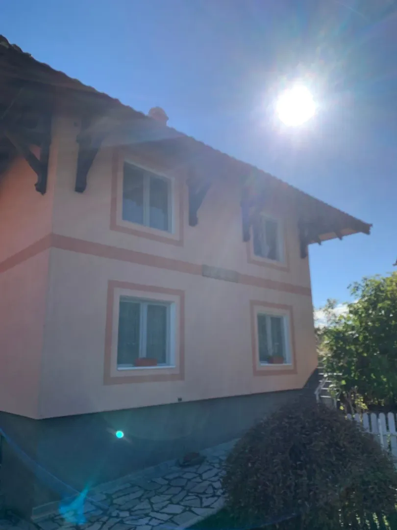 Exterior of a family house with a yard.