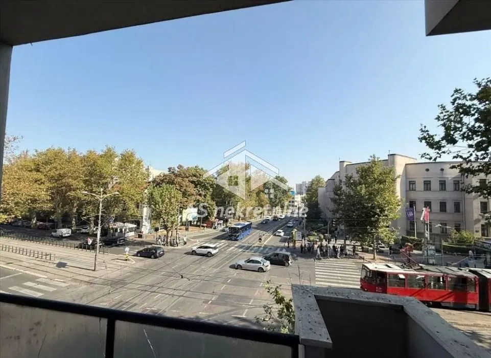 View from the terrace overlooking the city street and traffic.