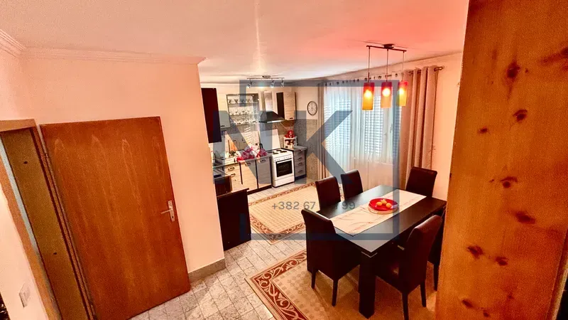 Dining area connected to the kitchen in an open-plan space.