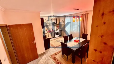 Dining area connected to the kitchen in an open-plan space. - image 12