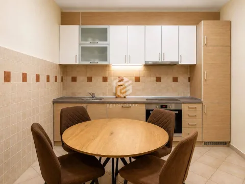 Kitchen with a dining table and four chairs. - image 3