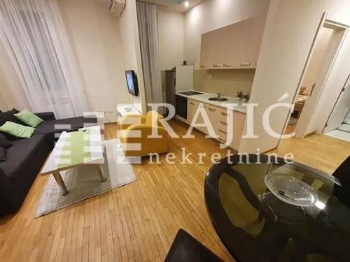 Living room connected with kitchen and dining area.