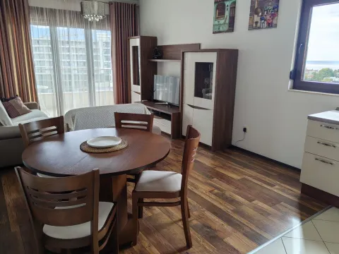 Living room with a dining area and seating set. - image 7