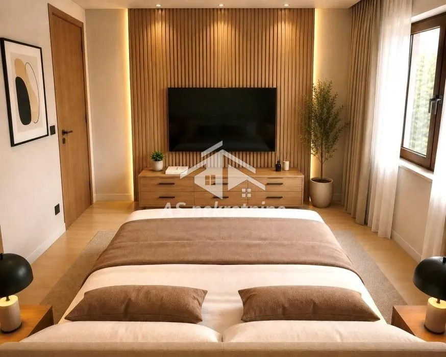Modern bedroom with a double bed, wooden wall paneling, and a TV.