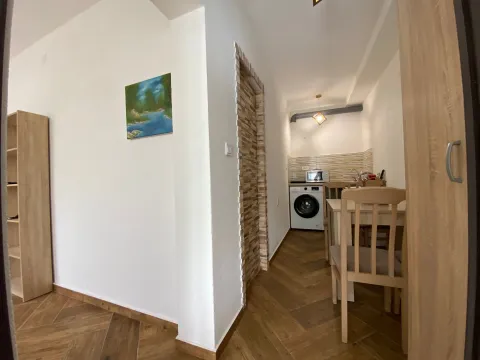 Small kitchen with a dining table and chairs. - image 7