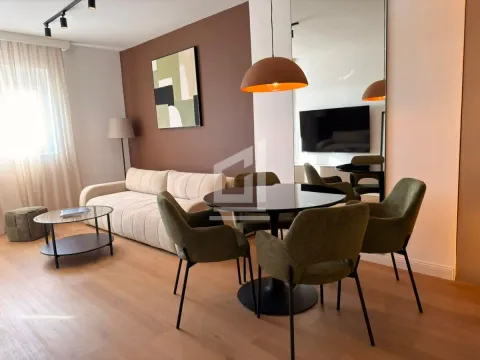 Living room with a dining area and modern furniture. - image 11