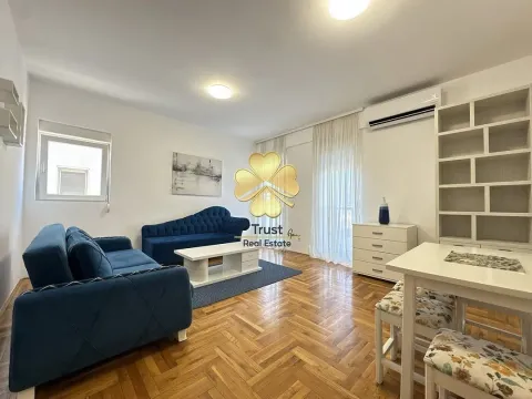 Spacious living room with a sofa set and dining area. - image 2