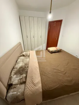 Bedroom with a double bed, wardrobe, and wooden door. - image 7
