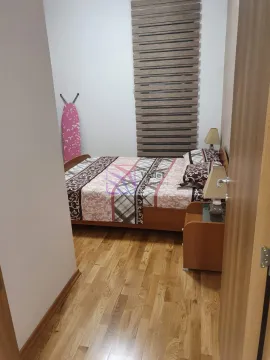 View of the bedroom with a double bed through an open door. - image 4