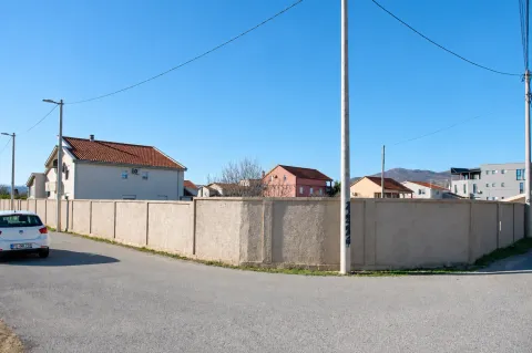 View of the exterior of the house with a fence and a street in the neighborhood. - image 8