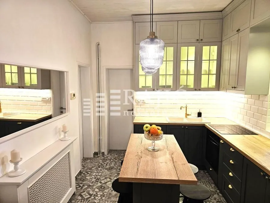 Modern and clean kitchen with a dining island.