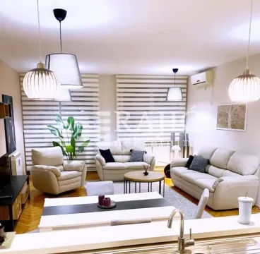 Spacious living room with a sofa set and dining table. - image 7