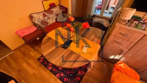 Smaller living room with a dining table and a sofa. - image 3