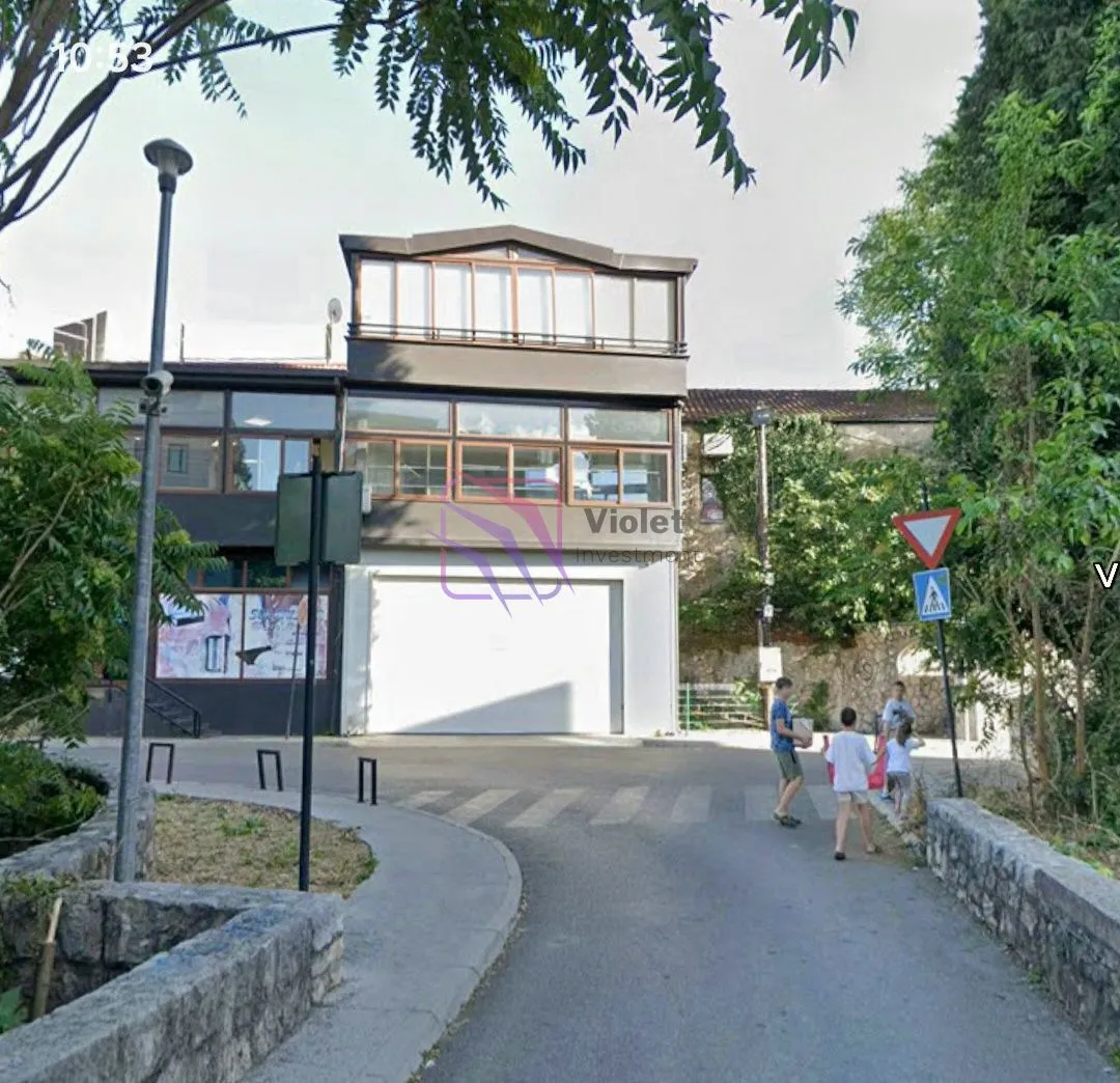 View of the exterior of the building with a street in the foreground.