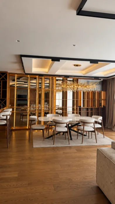Spacious living room with a dining area and modern ceiling lighting.