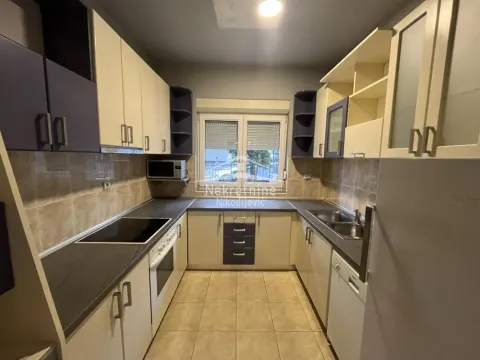 Separate kitchen with upper and lower kitchen cabinets and a window. - image 5