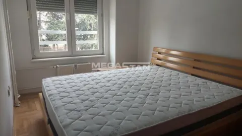 Bedroom with a double bed and a window overlooking the yard. - image 10