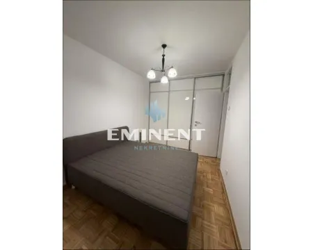Bedroom with a double bed and a fitted wardrobe. - image 7