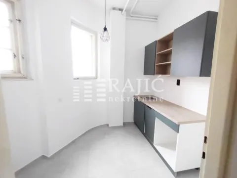 Empty kitchen with lower and upper cabinets. - image 5