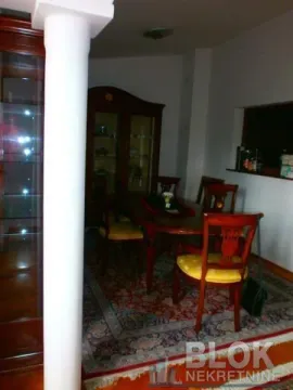 Dining area with a wooden table and chairs. - image 3